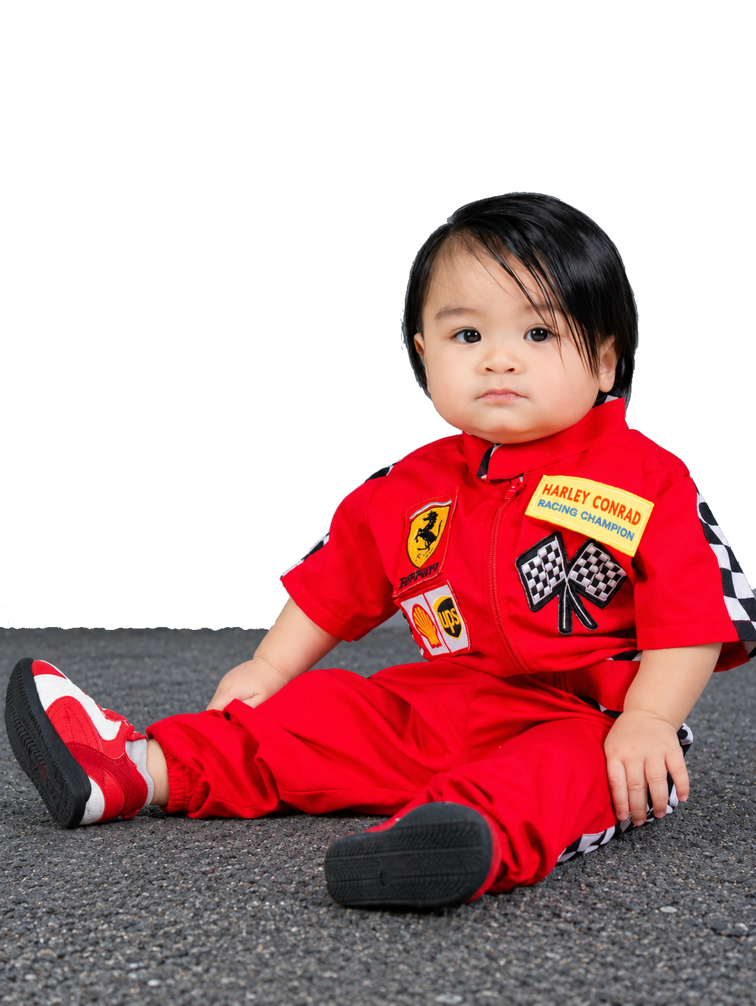 Harley smiling in a Ferrari racing suit